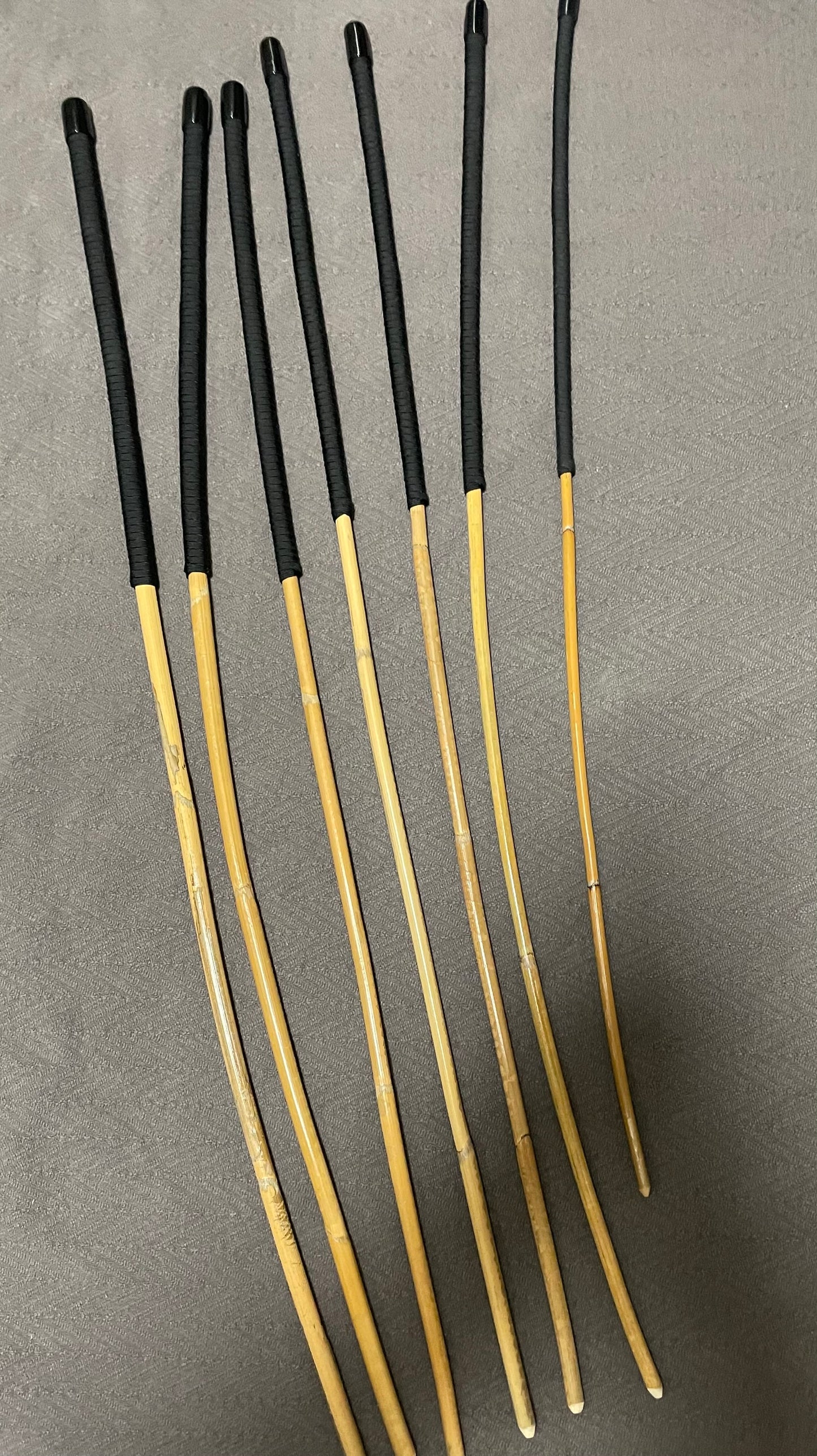 Kooboo Rattan Canes / School Canes Set of 7 Rattan Punishment Canes - 72 - 87 cms Length - Black Paracord Handles - Stripewell Canes