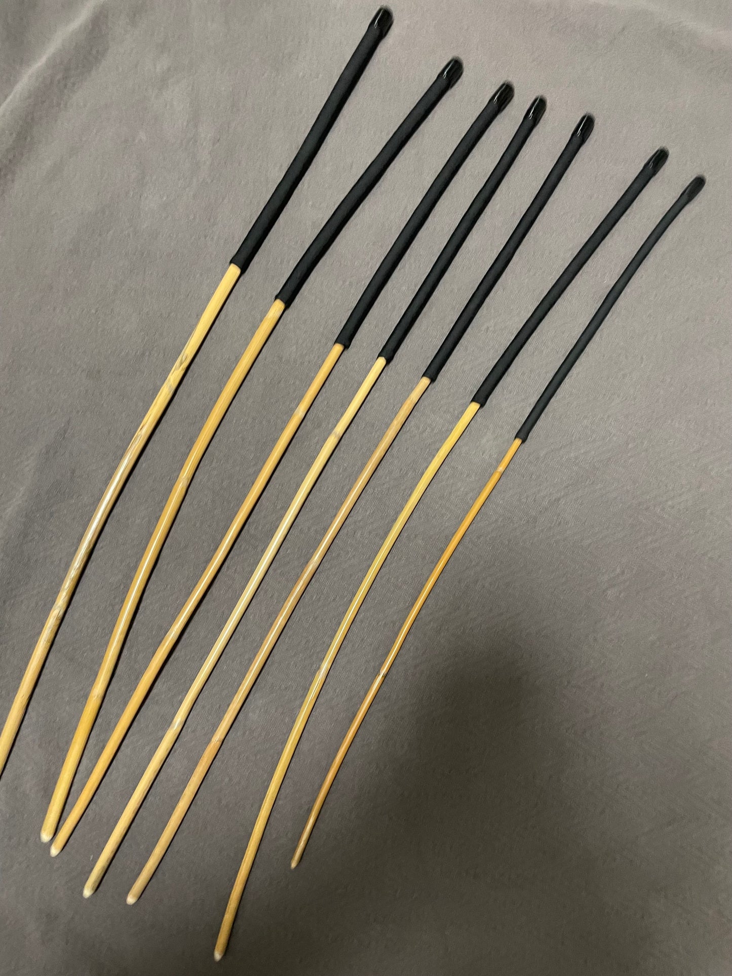 Kooboo Rattan Canes / School Canes Set of 7 Rattan Punishment Canes - 72 - 87 cms Length - Black Paracord Handles - Stripewell Canes