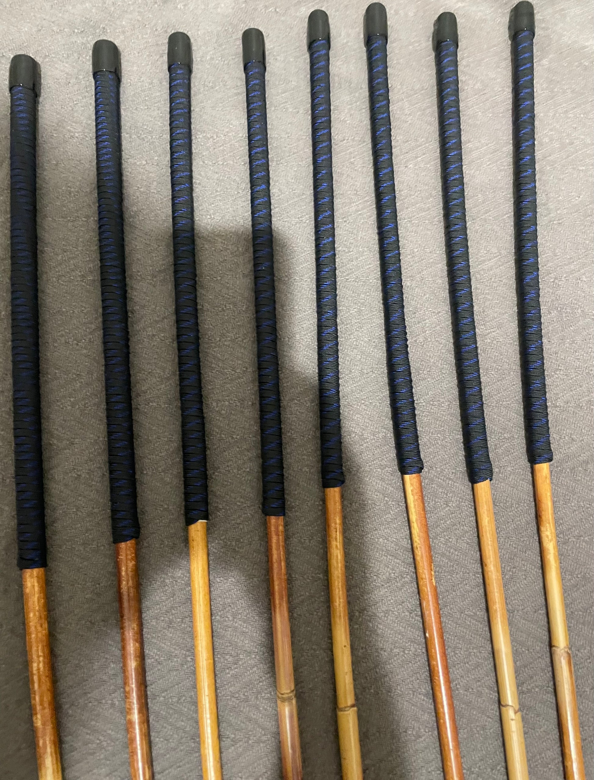 Set of 8 Natural Dragon Canes / BDSM Canes / School Canes SECONDS SET - 95 cms L -& 8.5 - 12.5 mm D - Blue Streak Paracord Handles - Stripewell Canes