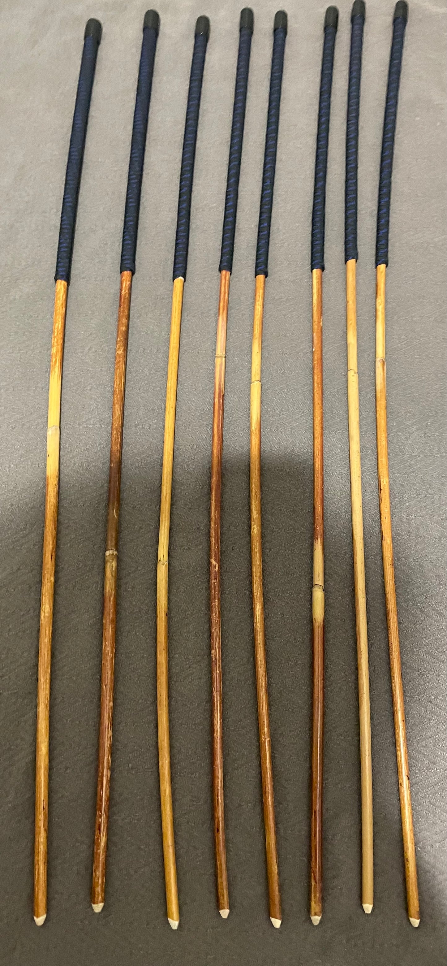 Set of 8 Natural Dragon Canes / BDSM Canes / School Canes SECONDS SET - 95 cms L -& 8.5 - 12.5 mm D - Blue Streak Paracord Handles - Stripewell Canes