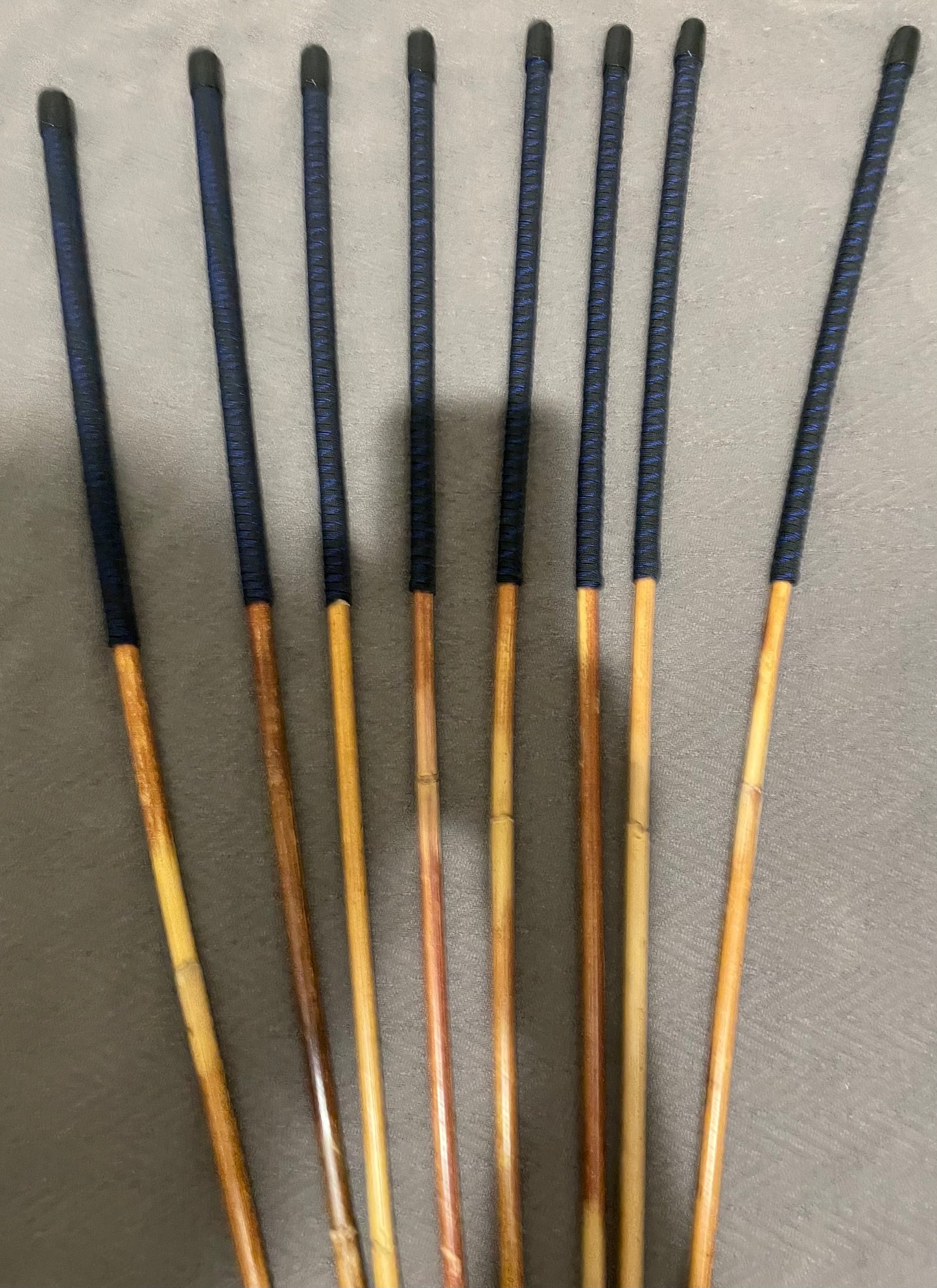 Set of 8 Natural Dragon Canes / BDSM Canes / School Canes SECONDS SET - 95 cms L -& 8.5 - 12.5 mm D - Blue Streak Paracord Handles - Stripewell Canes