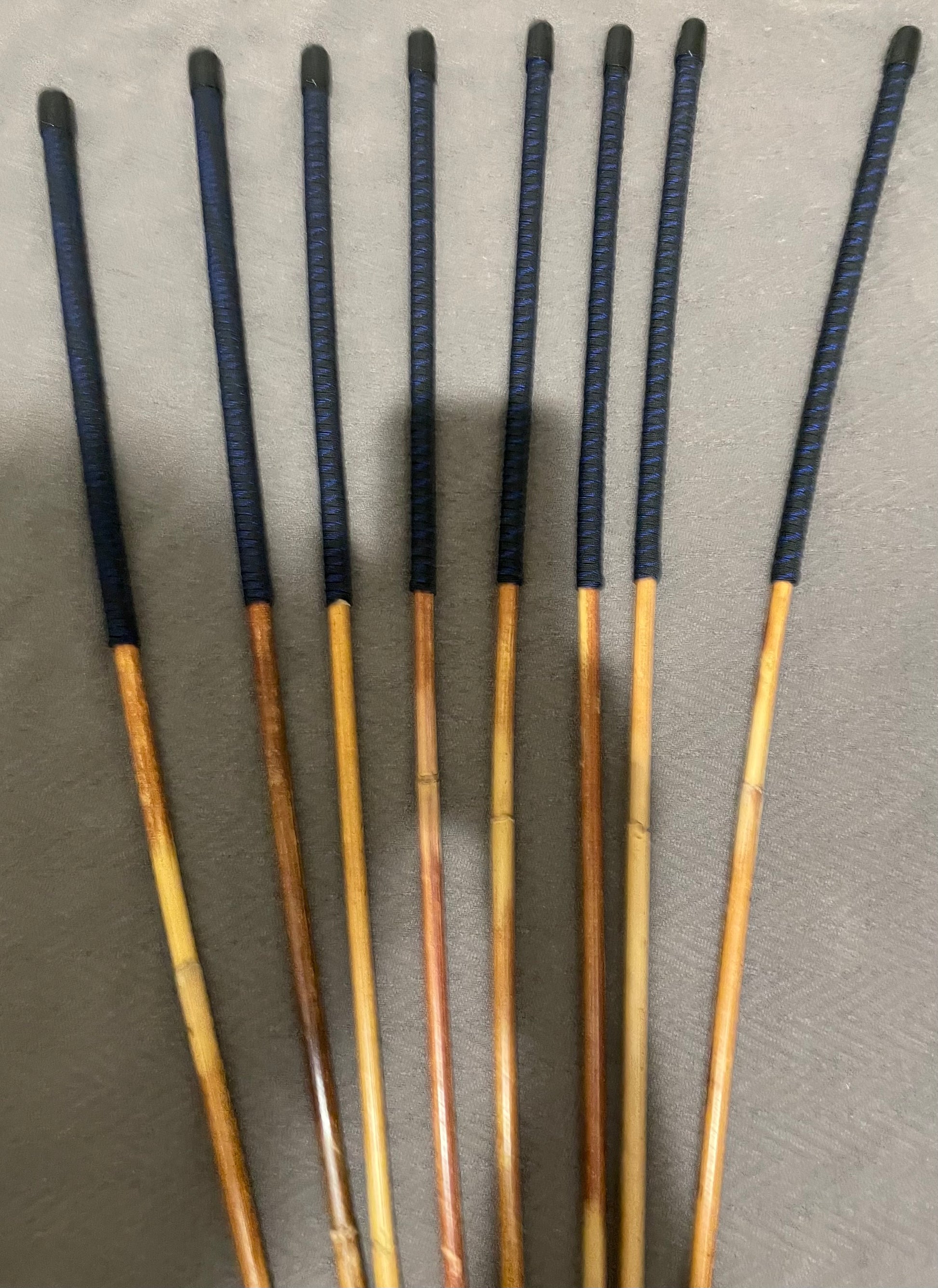 Set of 8 Natural Dragon Canes / BDSM Canes / School Canes SECONDS SET - 95 cms L -& 8.5 - 12.5 mm D - Blue Streak Paracord Handles - Stripewell Canes