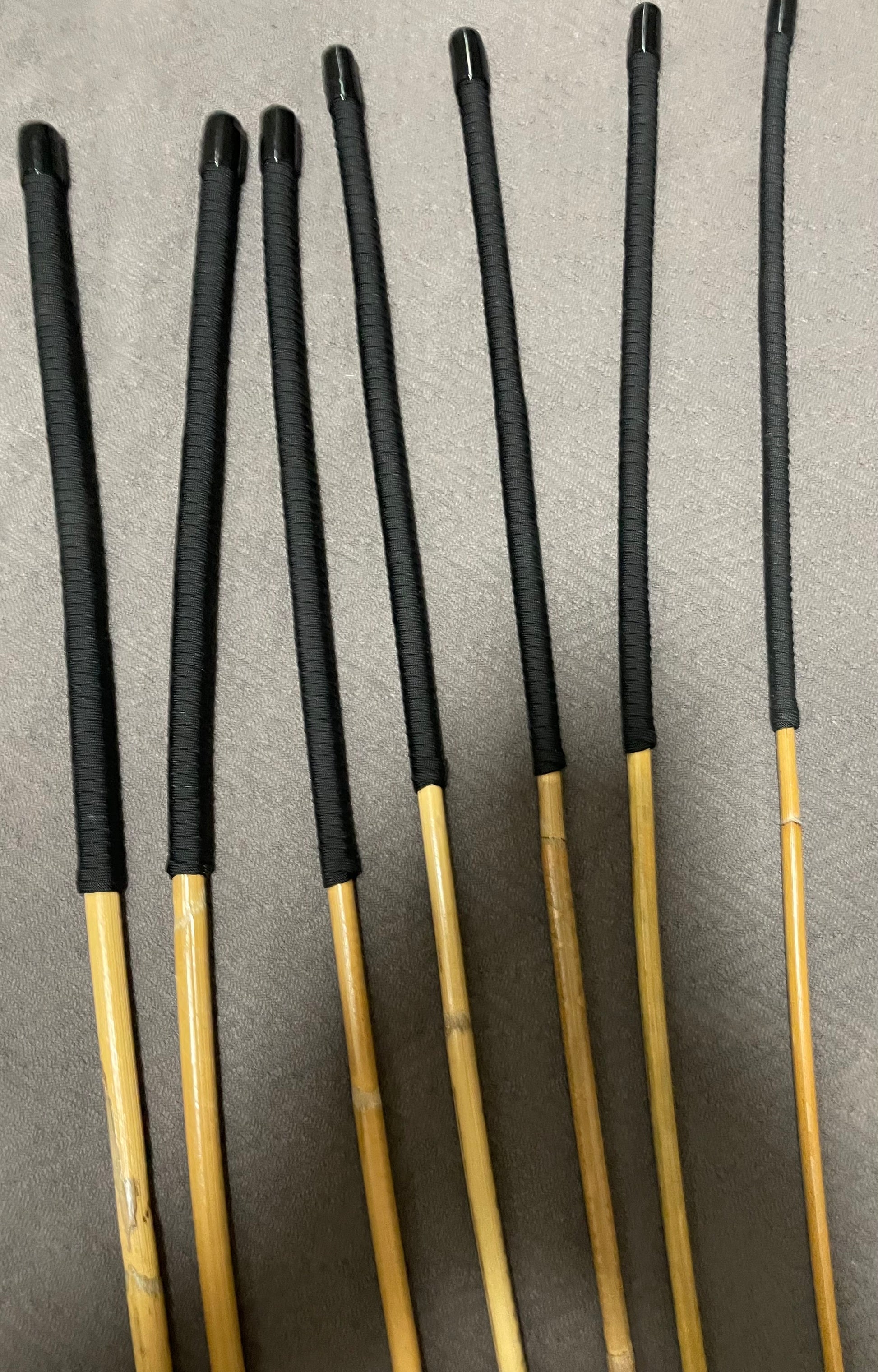 Kooboo Rattan Canes / School Canes  Set of 7 Rattan Punishment Canes - 72 - 87 cms Length - Black Paracord Handles - Stripewell Canes