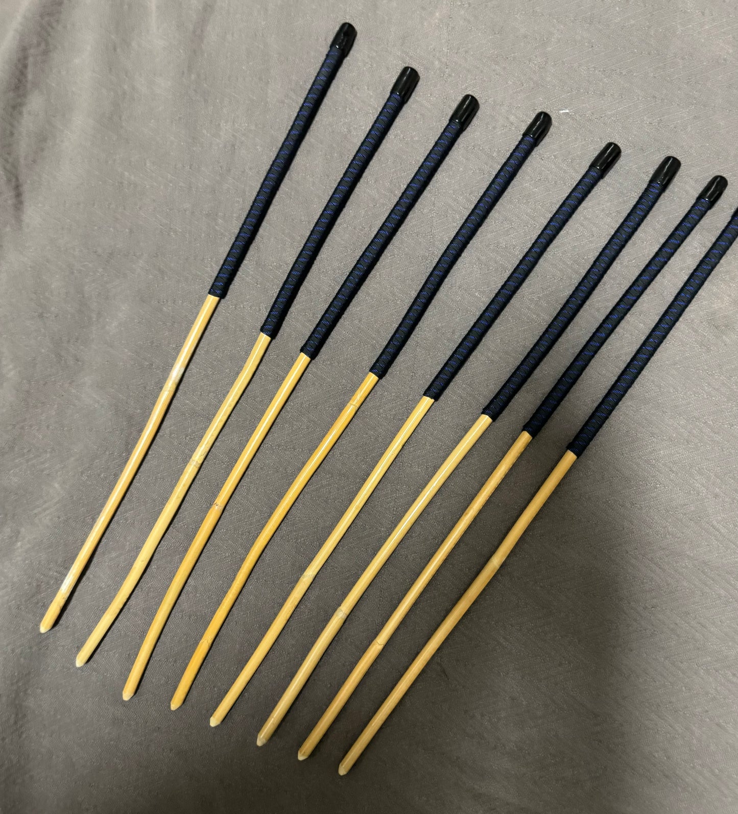 OTK Canes Set of 8 Kooboo Rattan Punishment canes / School Canes - 60 cms Length - BLUE STREAK Paracord Handles - Stripewell Canes