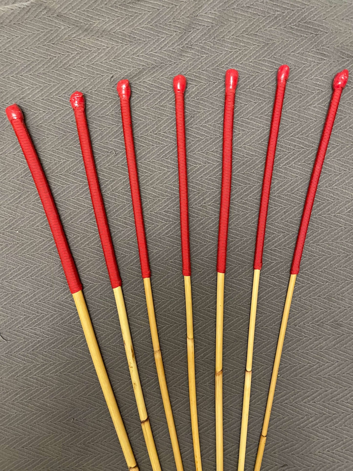 The Six Gate Set of 7 Natural Dragon Canes / BDSM Punishment Canes - 90 cms L & 7.5 - 13.5 mm D - Imperial Red Paracord Handles - Stripewell Canes