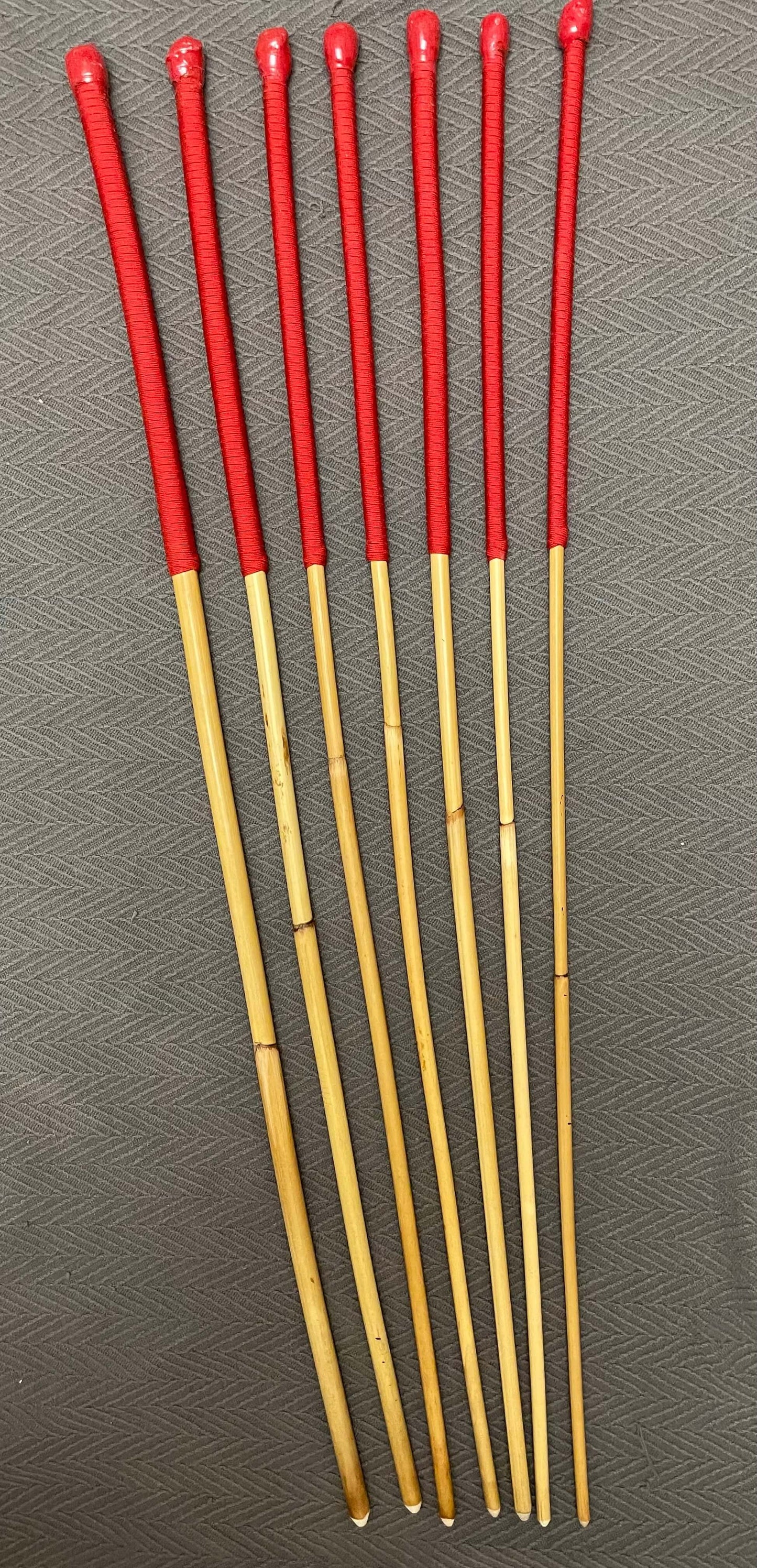 The Six Gate Set of 7 Natural Dragon Canes / BDSM Punishment Canes - 90 cms L & 7.5 - 13.5 mm D - Imperial Red Paracord Handles - Stripewell Canes