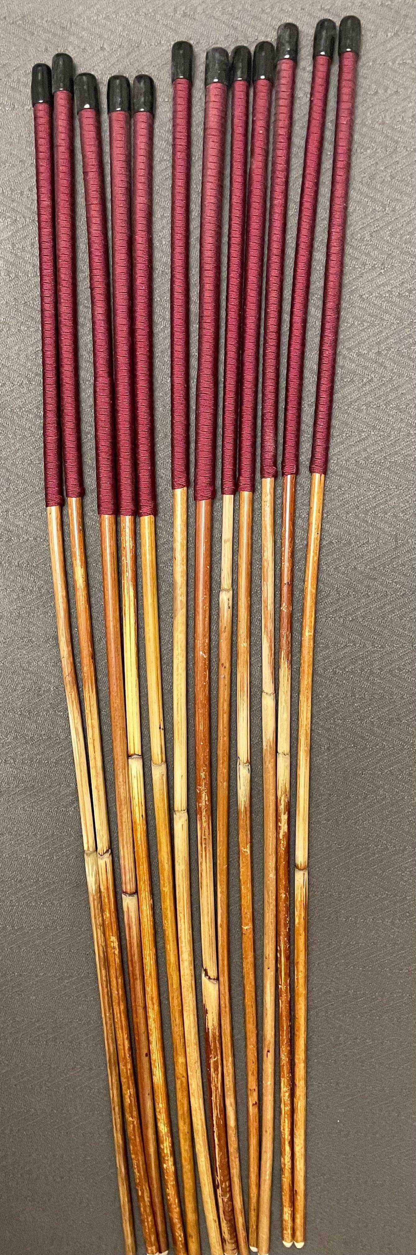 Set of 12 Natural Dragon Rattan Punishment Canes / School Canes / Whipping Canes - SECONDS SET - 95/100 cms Length - BURGUNDY HANDLES - Stripewell Canes