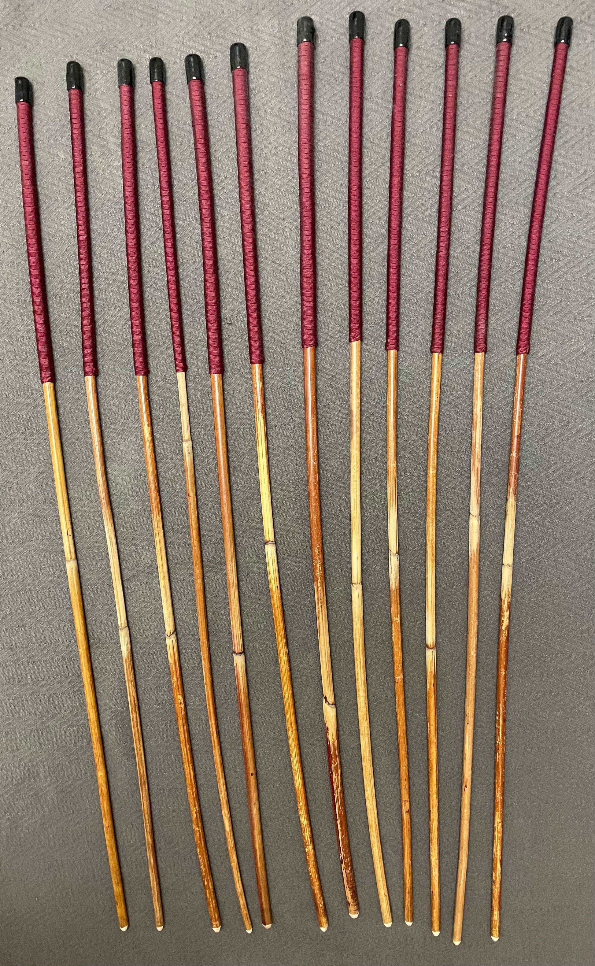 Set of 12 Natural Dragon Rattan Punishment Canes / School Canes / Whipping Canes - SECONDS SET - 95/100 cms Length - BURGUNDY HANDLES - Stripewell Canes