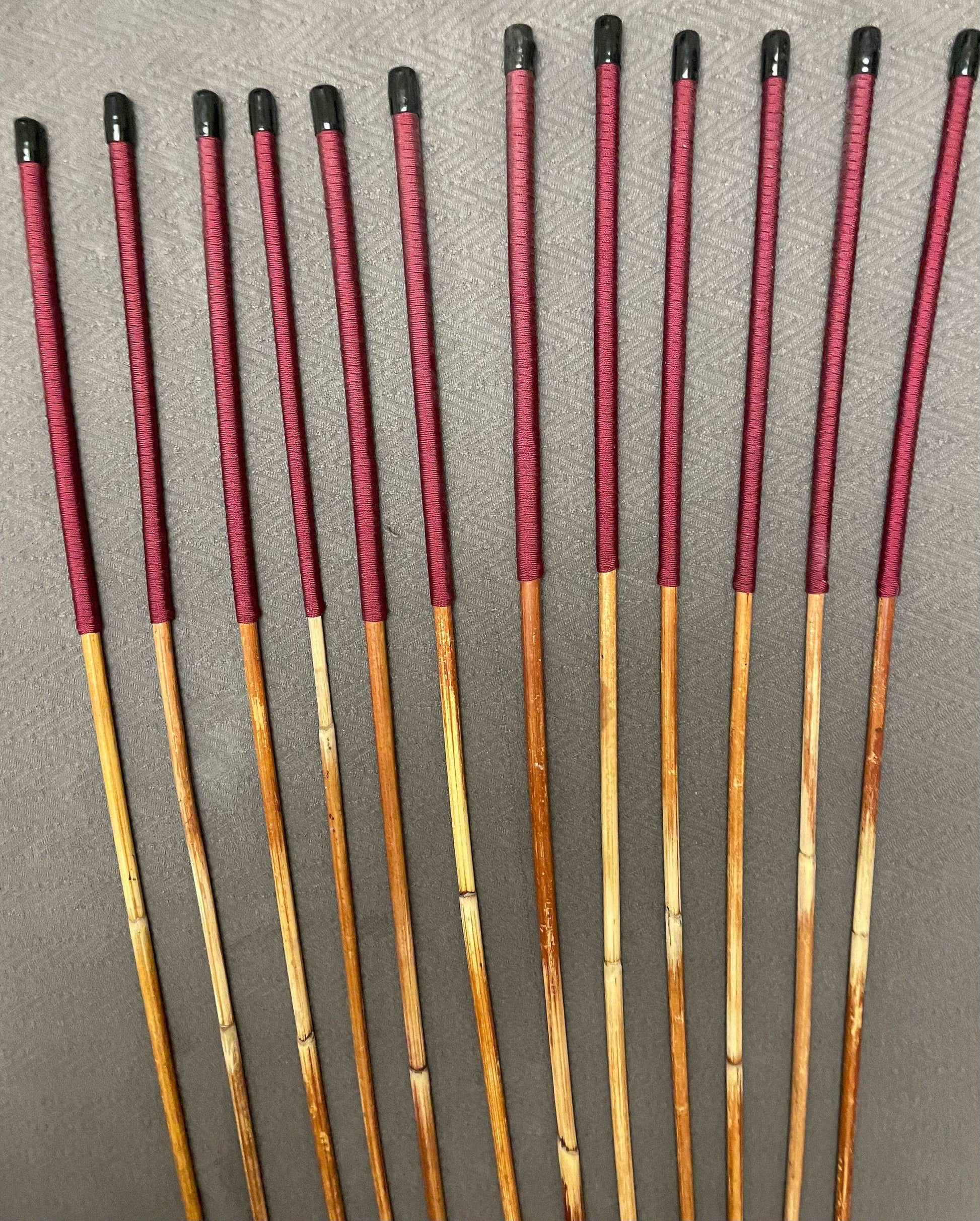 Set of 12 Natural Dragon Rattan Punishment Canes / School Canes / Whipping Canes - SECONDS SET - 95/100 cms Length - BURGUNDY HANDLES - Stripewell Canes