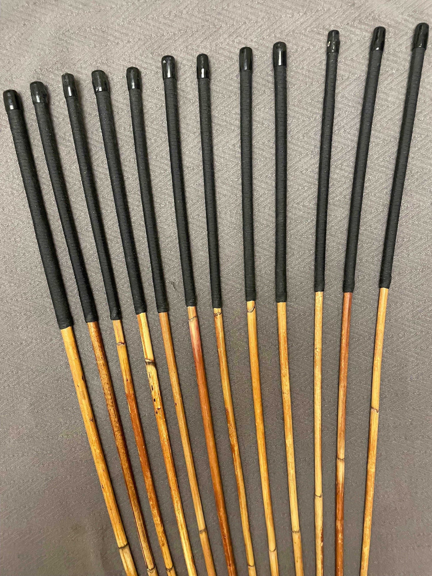 Set of 12 Natural Dragon Rattan Punishment Canes / School Canes / Whipping Canes - SECONDS SET - 95/100 cms Length - BLACK HANDLES - Stripewell Canes