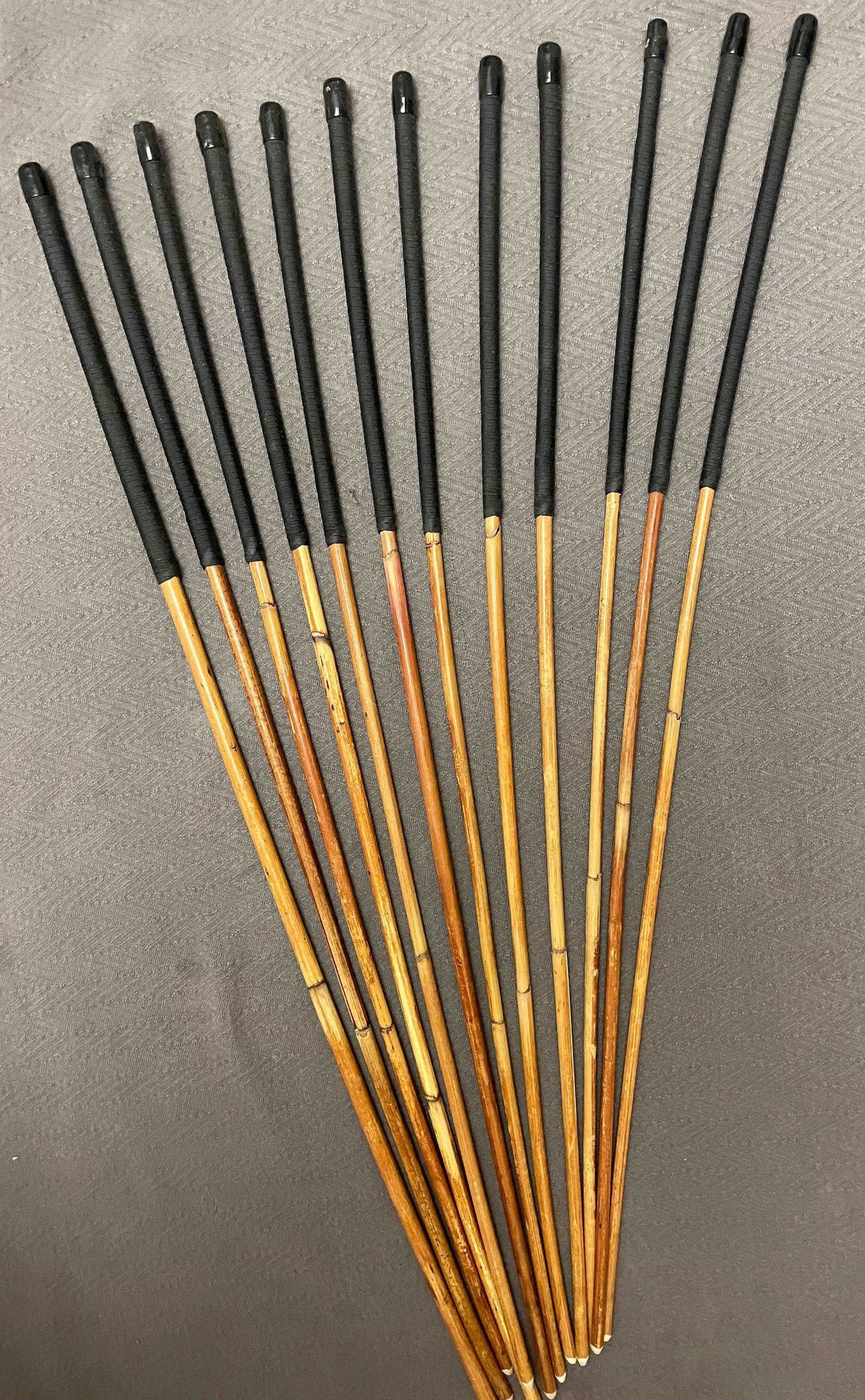 Set of 12 Natural Dragon Rattan Punishment Canes / School Canes / Whipping Canes - SECONDS SET - 95/100 cms Length - BLACK HANDLES - Stripewell Canes