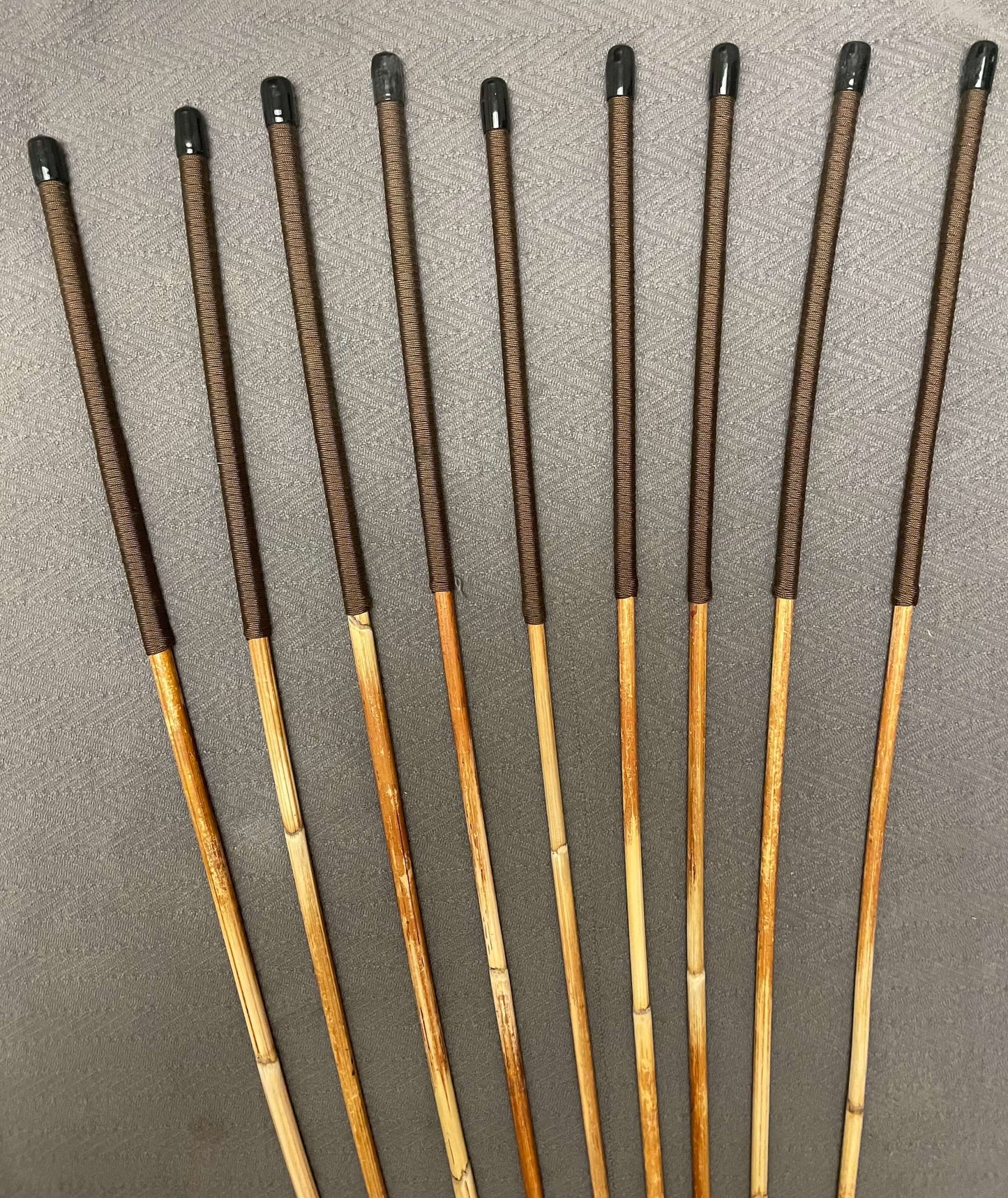 Set of 9 Dragon Canes / Punishment Canes / BDSM Canes Seconds Set - 95 to 100 cms Length - Brown Paracord Handles - Stripewell Canes