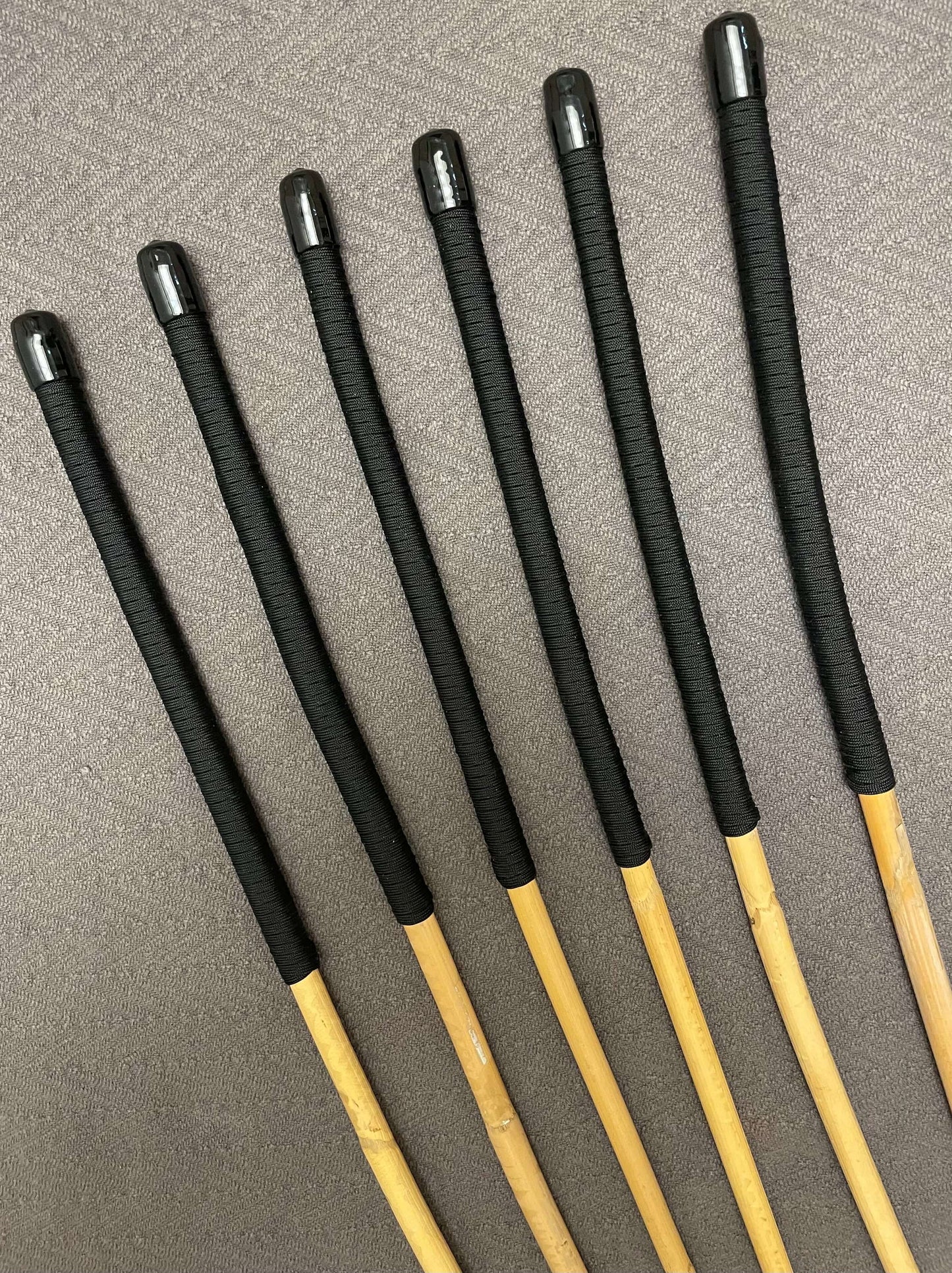 OTK Canes Set of 6 Kooboo Rattan Punishment canes / School Canes - 60 cms Length - BLACK Paracord Handles - Stripewell Canes