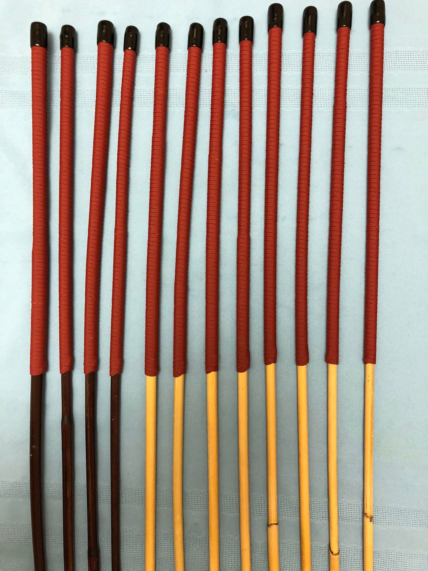 Whippy Mixed Dozen - Set of 12 Whippy/Stingy Natural/Smoked Dragon Rattan / BDSM Canes / School Canes - PRO SELECT SET - 90 cms Length - RED Paracord Handles